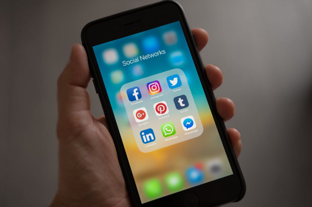 a mobile phone showing social media apps - Social Media and Depression