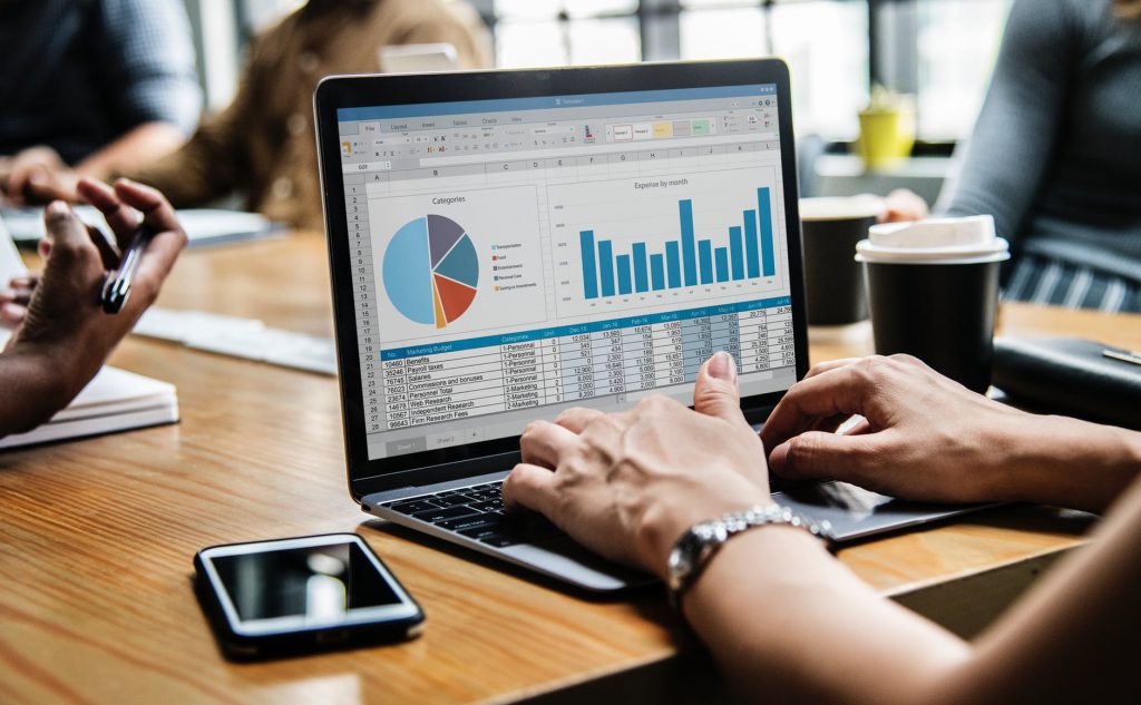 basic business success- laptop with spreadsheets