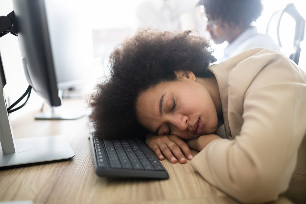business woman asleep with boredom, due to how badly some businesses are failing to communicate