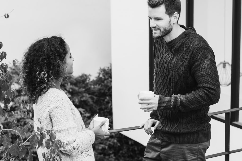type of neighbour - man and woman talking over coffee
