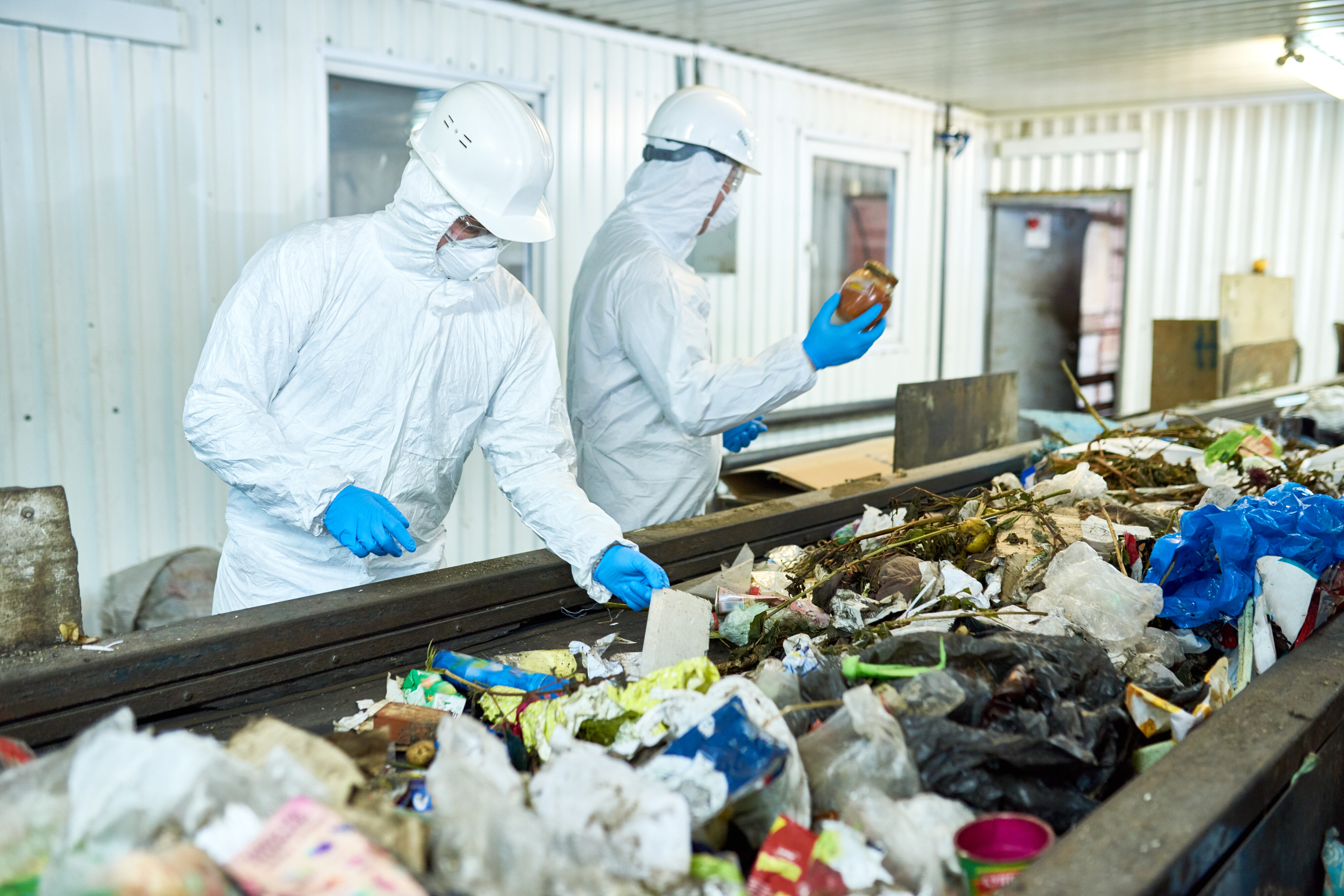 staff working in recycling plant, while owners wonder if machine vision imaging can help your business