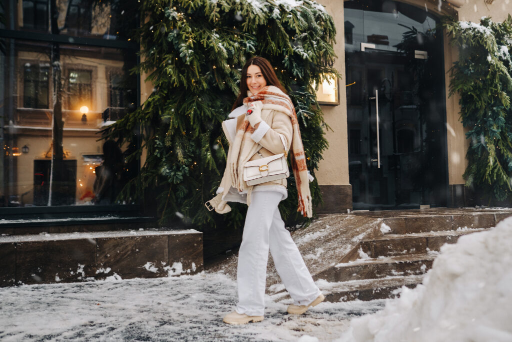 Woman shopping in the snow, finding the right bag for winter